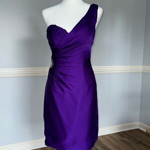 Angelina Faccenda dark purple one shoulder evening dress.